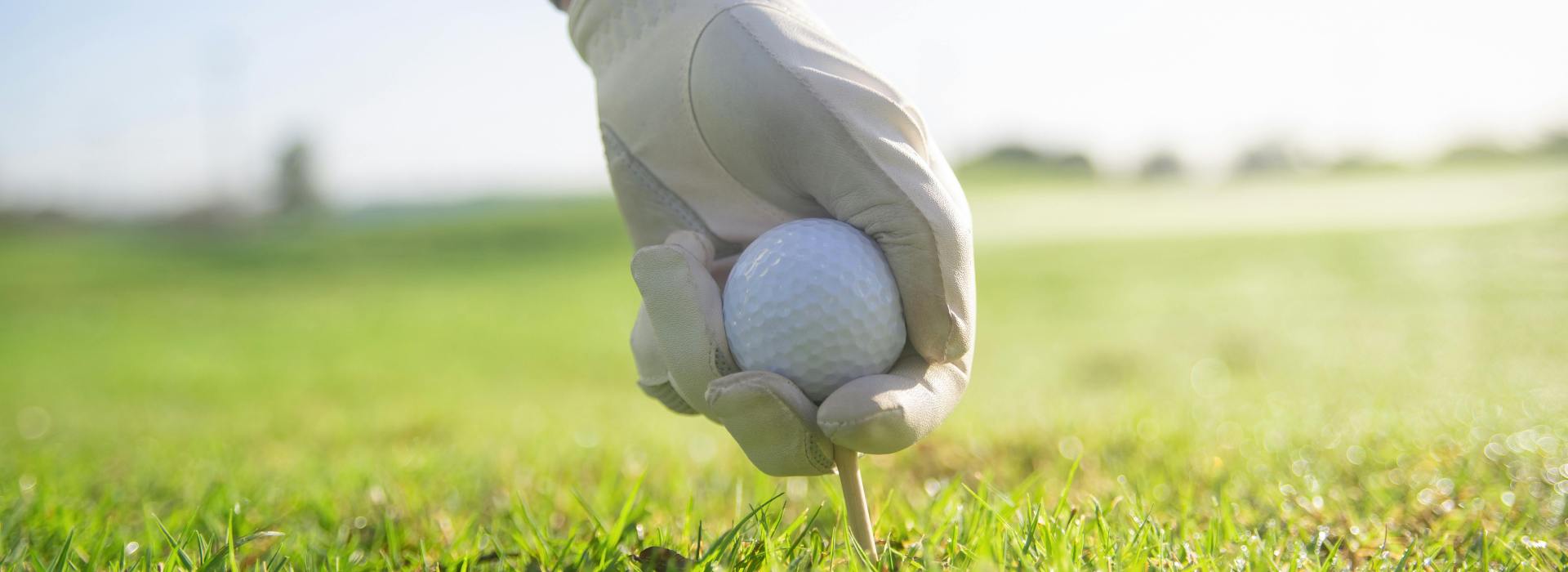 Golf ball placed on tee
